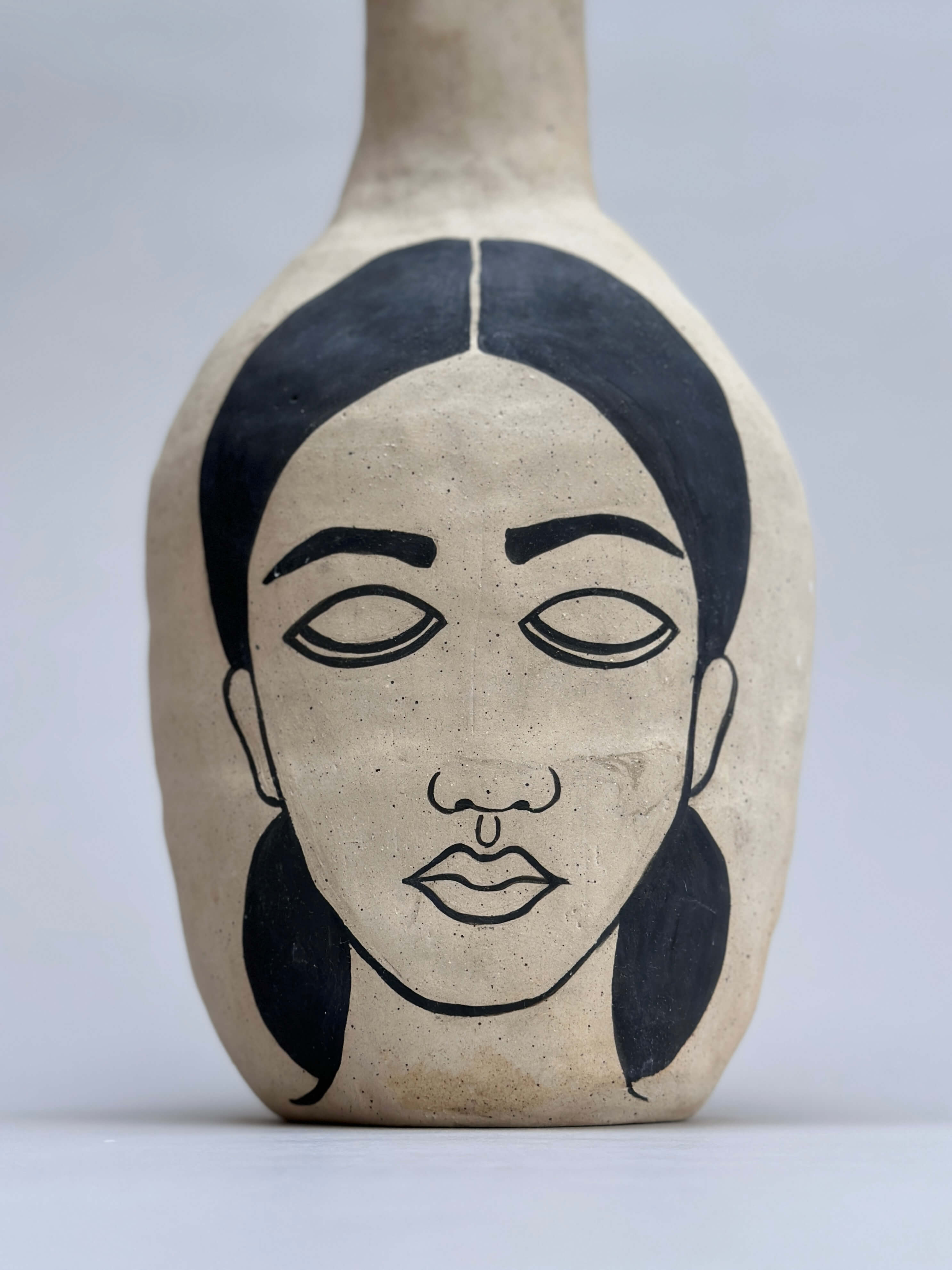 Hand-painted white clay art vase available at Condesa Gin Studio.